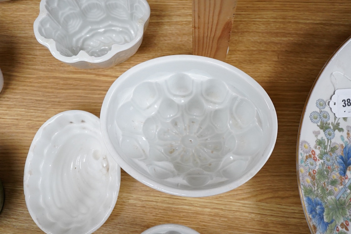 A collection of fifteen mostly 20th century ceramic jelly moulds, largest 16cm high